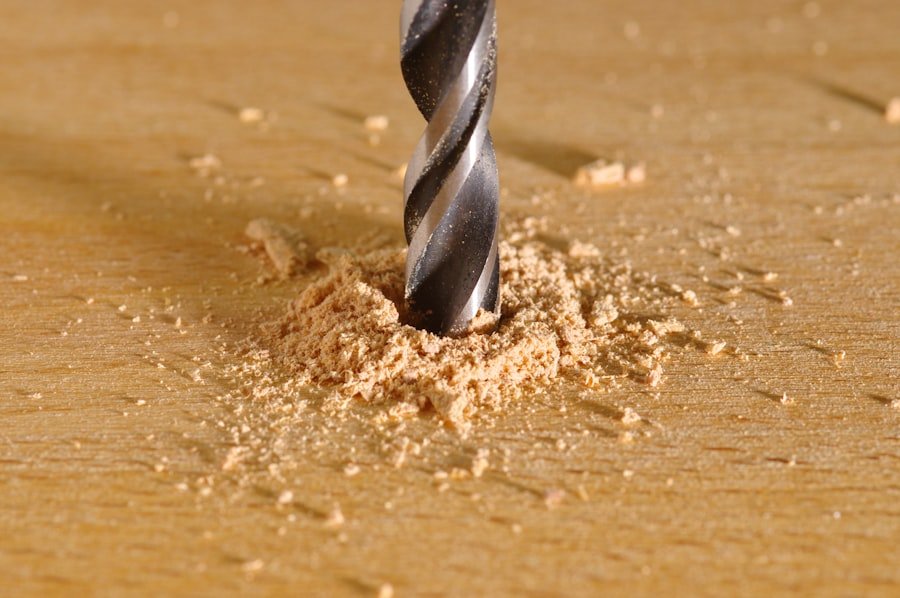 Driving a screw into wood with a cordless drill