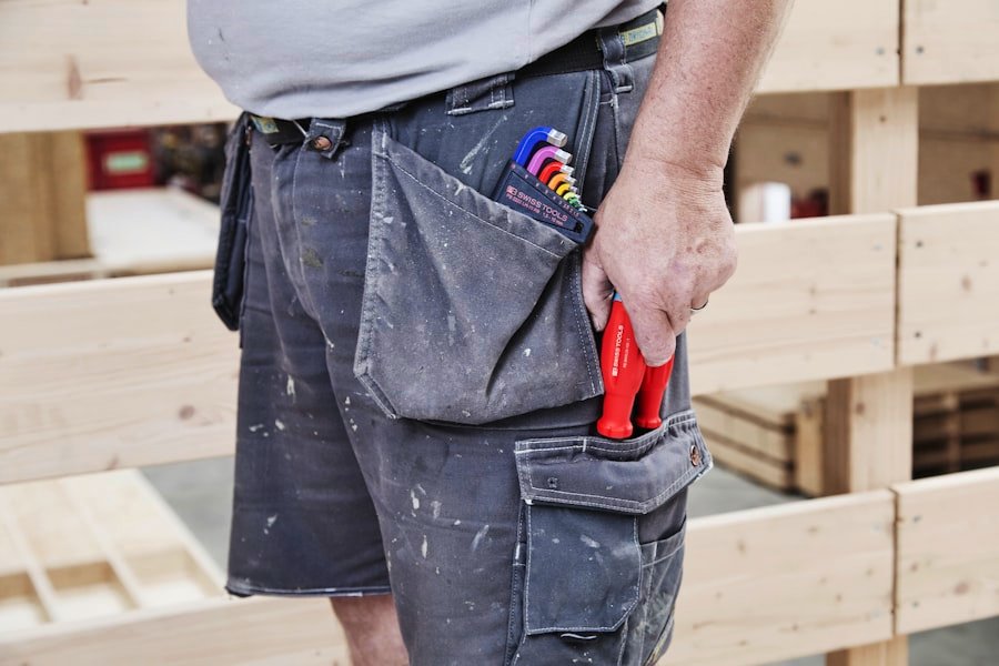 Carpenter's work trousers with a pencil, pliers and ruler in the pocket